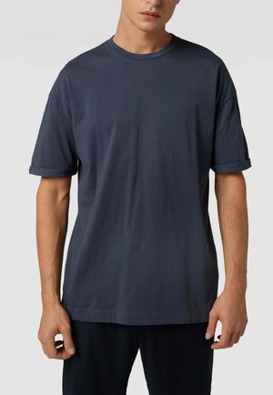 Marineblaues Baumwoll-T-Shirt mit kurzen Ärmeln, umgeschlagenen Bündchen, rundem Halsausschnitt und lockerem Schnitt. Glatte Textur und minimalistisches Design.