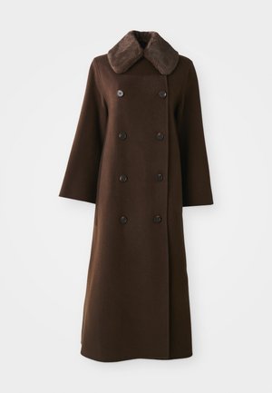 Brown double-breasted coat with a fur collar, long sleeves, and a straight silhouette. Features black buttons and soft wool-like texture.