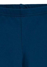 Granatowe legginsy o gładkiej fakturze i elastycznym pasku w talii. Posiadają prosty design bez wzorów czy akcentów.