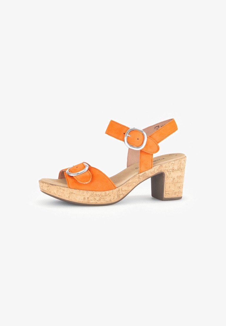 Orange suede heeled sandal with cork platform and block heel. Features two silver metal buckles on the straps. Open toe design.