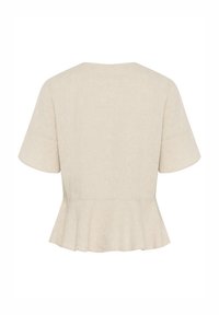 Peplum top v světle béžovém lnu s krátkými rukávy, kulatým výstřihem a jemnou texturou. Volánový, rozšířený lem detailu na spodní části.
