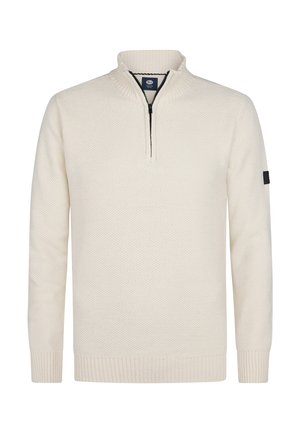 Suéter de punto color crema con media cremallera en el frente, cuello acanalado, puños y dobladillo, y una mancha oscura en la manga izquierda.