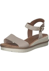 Sandales compensées beiges avec deux larges brides sur le devant, une bride autour de la cheville avec boucle, et une semelle intérieure en liège texturé. Présente une semelle extérieure blanche striée.