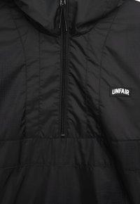 UNFAIR ATHLETICS Chaqueta de entrenamiento - black