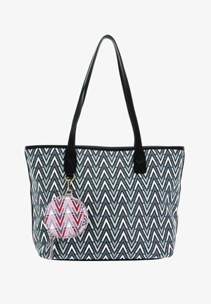 Grand sac fourre-tout avec un motif en chevrons noir, blanc et gris. Dispose de poignées noires et d'une pochette ronde détachable avec un design géométrique.