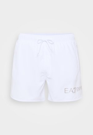 Calções de banho brancos com um cós elástico e cordão. Apresenta um logotipo impresso em prateado no lado inferior direito. Textura suave.