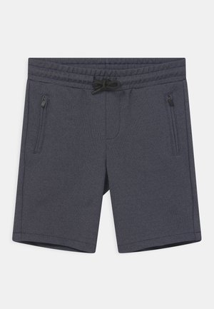 Donkergrijze sportshorts gemaakt van een structuurstof, met een elastische tailleband met trekkoord en twee ritszakken aan de zijkant.