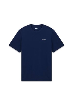 T-shirt en coton bleu marine à manches courtes et col rond. Présente un petit logo blanc "GUESS" sur le côté gauche de la poitrine. Texture lisse.