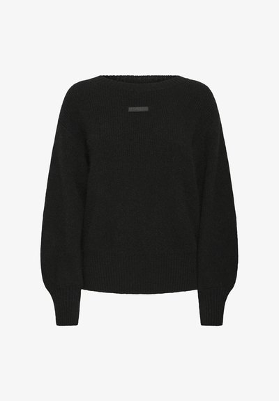 Fekete pulóver laza szabással, bordázott textúrával és hosszú ujjakkal. Az elülső nyakrészen finom logórészlet található.