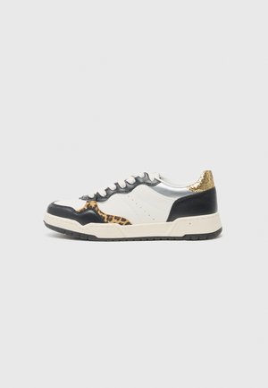 White and black sneakers with leopard print accents, silver and gold detailing, textured leather, and a rubber sole.