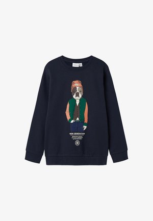 Marineblaue Sweatshirt mit einem Cartoon-Hund, der eine grüne Jacke und ein oranges Shirt trägt, mit dem Text "NEUE GENERATION" auf der Vorderseite.