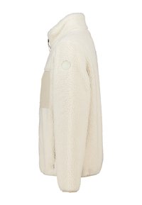 Light beige fleece jacket with a high collar, side zip, oversized fit, textured material, and a small round logo on the sleeve.