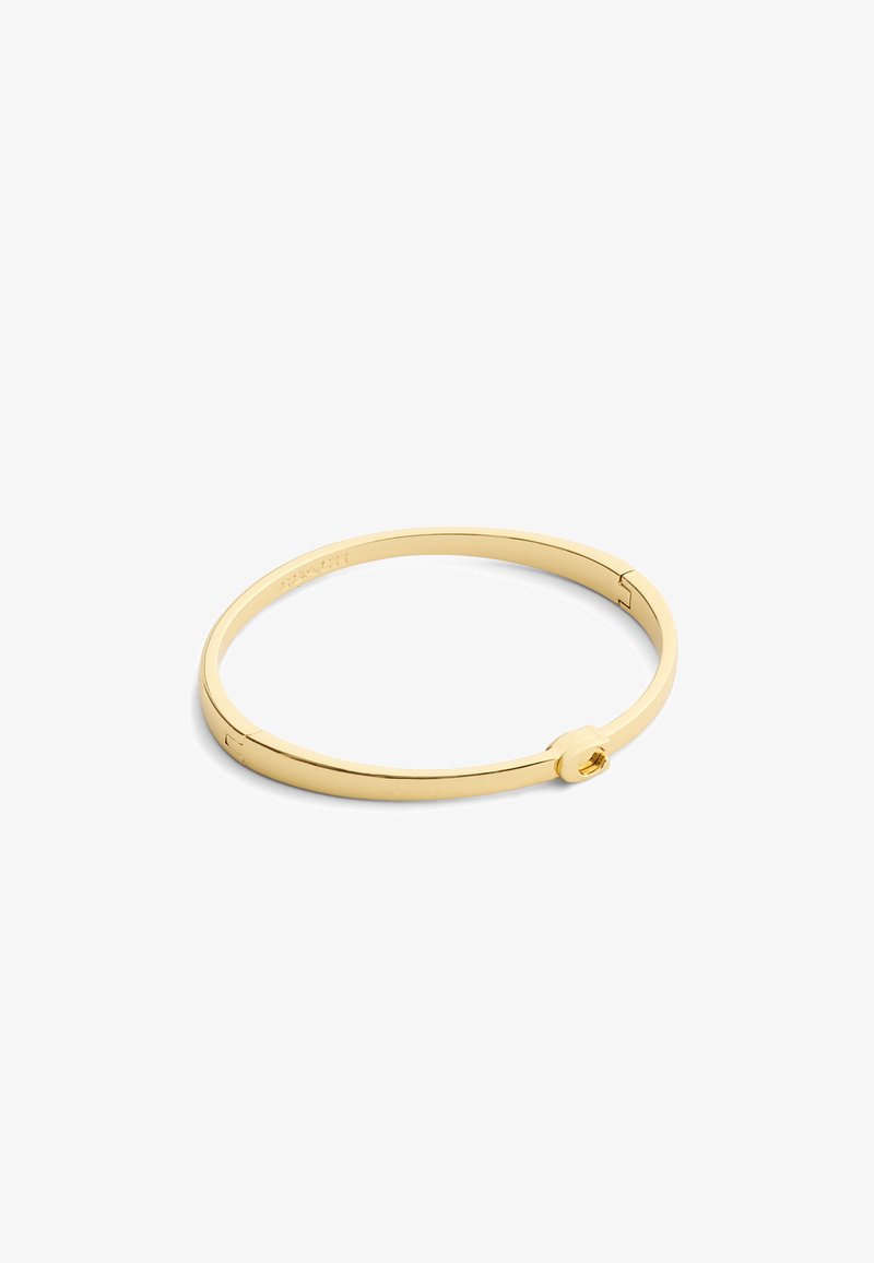 Bracciale rigido in metallo color oro con una forma rotonda elegante. Presenta una chiusura sicura con un piccolo dettaglio accentato circolare. Superficie liscia.