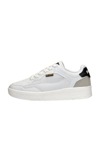 White sneakers featuring a smooth leather upper, lace closure, grey and black accent on the heel, and a thick rubber sole.