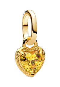 Pendentif en forme de cœur avec une finition dorée, un grand cristal jaune au centre et des accents texturés autour des bords.