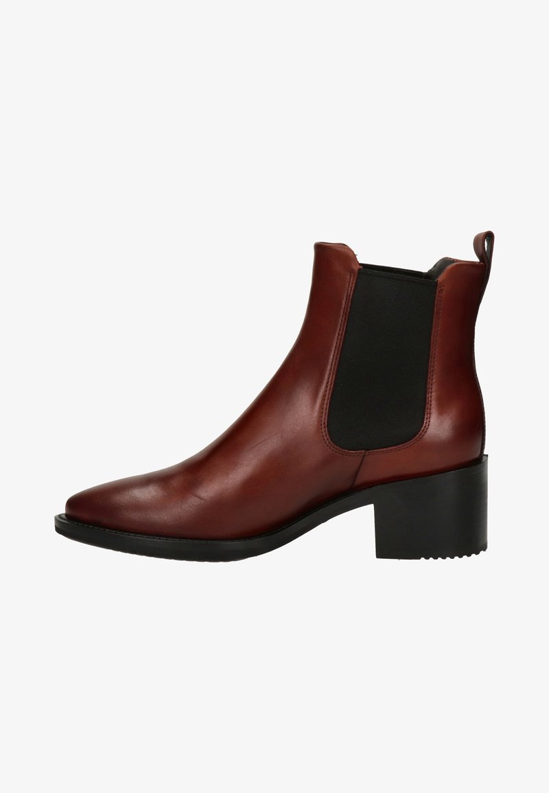 Bottines en cuir marron avec un bout pointu et un panneau élastique sur le côté. Talon bloc et semelle en caoutchouc noir texturé. Finition lisse.