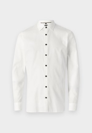 White long-sleeve shirt made of smooth fabric featuring a button-down collar and six black buttons down the front.