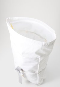 White fabric bag with a roll-top design, featuring a smooth texture, yellow zipper pull, and a small gray accent strap.