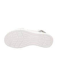Biała podeszwa trampka z teksturowaną gumową powierzchnią, z falistym wzorem i rowkami elastycznymi dla lepszej przyczepności. Logo wytłoczone na środku.
