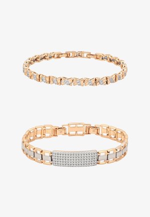 Dwie złote bransoletki; jedna z ukośnymi klastrami diamentów, druga z prostokątnymi ogniwami i centralnym elementem z diamentów pavé.