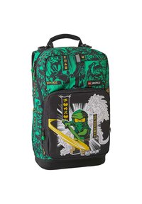 Green and black backpack featuring LEGO Ninjago graphics, a large front pocket, padded straps, and a top handle for easy carrying.
