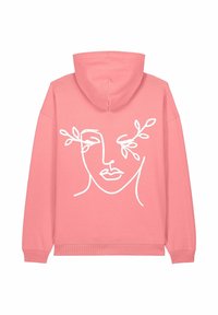 Felpa rosa con un disegno a linea bianca di un volto e foglie sul retro. Realizzata in cotone morbido con polsini e orlo a coste.
