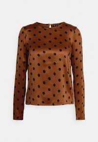 Blouse marron à manches longues avec des pois noirs, col rond et fermeture à boutons à l'arrière.