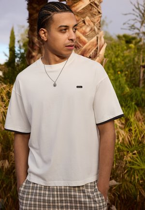 DOUBLE LAYER BADGE TEE UNISEX - Basic T-shirt - ecru