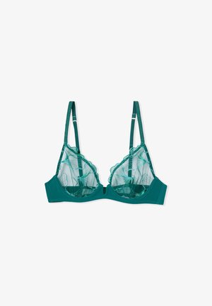 Reggiseno verde in pizzo con bordo ondulato, coppe in rete e spalline regolabili, dotato di banda in tessuto liscio e chiusura con gancio sul davanti.