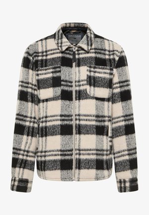 Kurtka w kratę w odcieniach beżu, czerni i szarości. Posiada pełny zamek błyskawiczny, kołnierz, dwie kieszenie na piersi oraz miękki, teksturowany materiał.