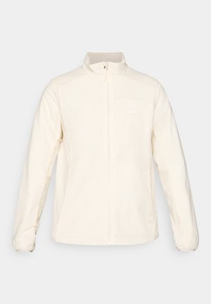 Veste légère blanche avec un col montant, fermeture éclair intégrale à l'avant, manches longues, dotée d'une poche poitrine et d'un logo discret sur le côté supérieur gauche.