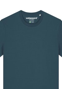 Teal crew neck t-shirt van zachte stof, met een eenvoudig ontwerp zonder patronen. Etiket met de merknaam "watapparel" zichtbaar aan de binnenkant van de kraag.