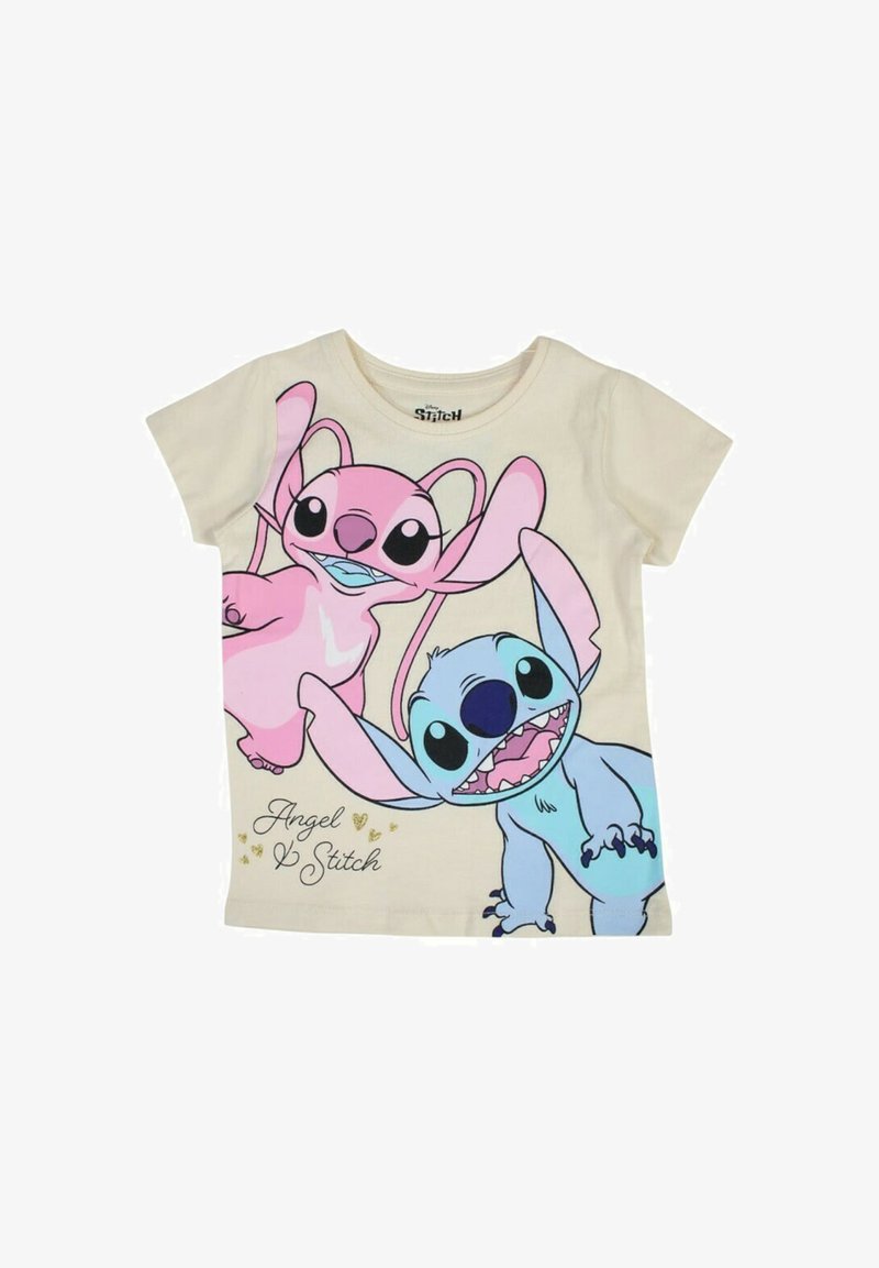 T-shirt en coton crème présentant un imprimé graphique de personnages de dessin animé roses et bleus avec des oreilles surdimensionnées, étiqueté "Angel & Stitch".