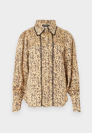 Μπεζ μπλούζα με μακριά μανίκια και μαύρο αφηρημένο μοτίβο, μυτερός γιακάς, κουμπιά μπροστά και μαύρο περίγραμμα κατά μήκος της γραμμής των κουμπιών και των άκρων του γιακά.