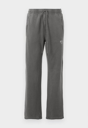 Gray sweatpants with a drawstring waist, side pockets, and a subtle logo on the thigh. Made from a soft, durable fabric with a straight cut.