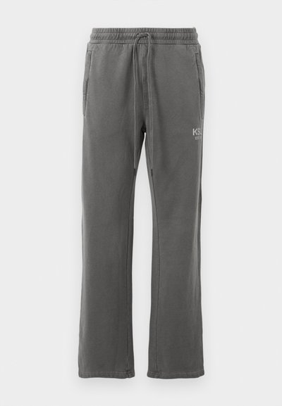 Gray sweatpants with a drawstring waist, side pockets, and a subtle logo on the thigh. Made from a soft, durable fabric with a straight cut.