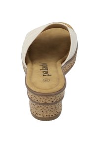 White slip-on wedge sandal with a soft suede footbed and textured beige platform. Rounded toe and minimal stitching detail.