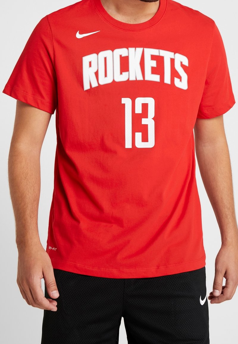 Czerwona koszulka Nike z napisem "ROCKETS" i numerem "13" w białym kolorze. Krótkie rękawy, okrągły dekolt, wykonana z oddychającego materiału.
