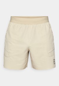 Ανοιχτό μπεζ σορτς με υφαντό σχέδιο, ελαστική μέση, πλαϊνές τσέπες και διακριτικό λογότυπο στο κάτω δεξί πόδι. Λεπτή υφή.