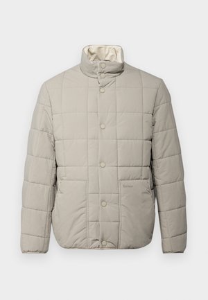 Light gray quilted jacket with a high collar, snap buttons, and two front pockets. Soft exterior and interior lining, featuring a subtle logo.