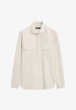 Hellbeiges Langarmhemd mit Kragen, zwei aufgesetzten Taschen vorne und durchgehender Knopfleiste; aus glattem Stoff gefertigt.