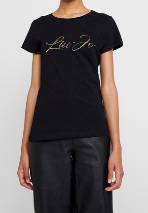 Sort bomulds T-shirt med et guld rhinsten "Liu Jo" logo i kursiv stil. Korte ærmer og rund halsudskæring. Glat tekstur.