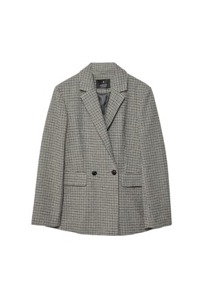 Blazer med hundetand mønster i sort og hvid, letvægtsstof, dobbeltknappet design, spidse klapper og to forlommer.