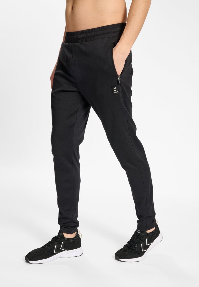 Hummel HMLMT INTERVAL TAPERED - Pantalones deportivos - black