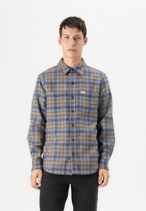 Blue and brown plaid flannel shirt with a button-up front, collar, long sleeves, and a small brand tag on the left side.
