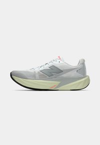 Light gray athletic shoe with a mesh upper, a cushioned light green sole, and a black rubber outsole. Features a notable 'N' logo and red accents.