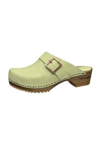 Light green suede clog with a rectangular brown metal buckle, a wooden base, and serrated rubber sole, featuring contrasting stitching details.