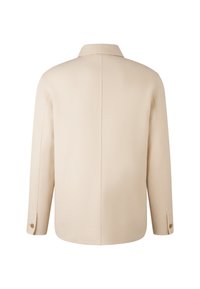 Beżowa wełniana kurtka z klasycznym kołnierzem, długimi rękawami i zapięciem na guziki. Posiada gładką fakturę i czysty, minimalistyczny design.