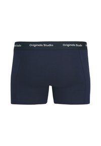 Tumši zili bokseri ar melnu jostu, kurā ir balts uzraksts "Originals Studio". Izgatavoti no gludas, elastīgas auduma.