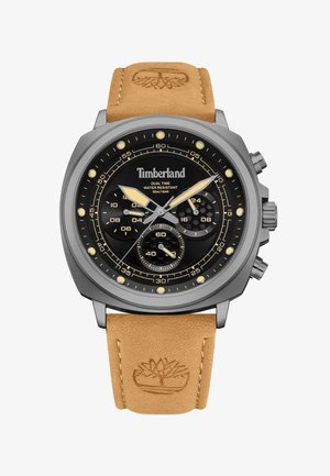 Zegarek kwarcowy z czarną tarczą, stalową obudową i brązowym skórzanym paskiem. Posiada dwa strefy czasowe, funkcje chronografu oraz logo Timberland.